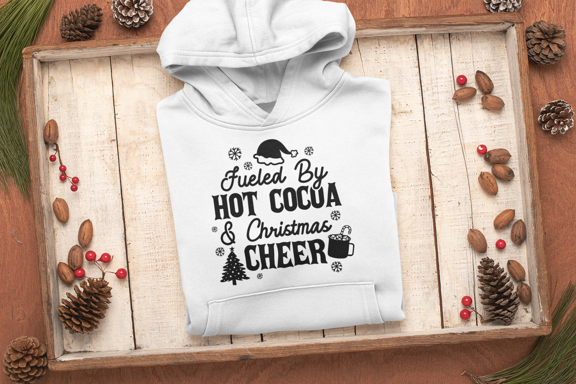 "Fueled by Hot Cocoa & Christmas Cheer" Unisex Hoodie by RanggRiwaaz for Christmas Eve, Christmas celebration