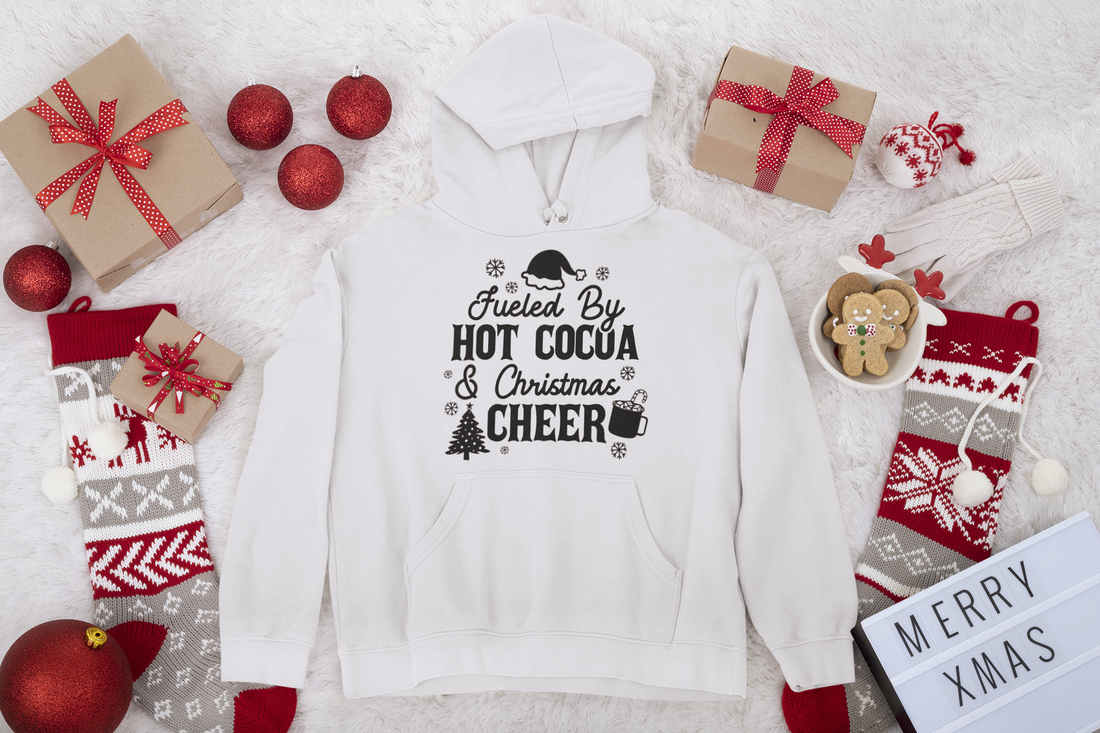 "Fueled by Hot Cocoa & Christmas Cheer" Unisex Hoodie by RanggRiwaaz for Christmas Eve, Christmas celebration