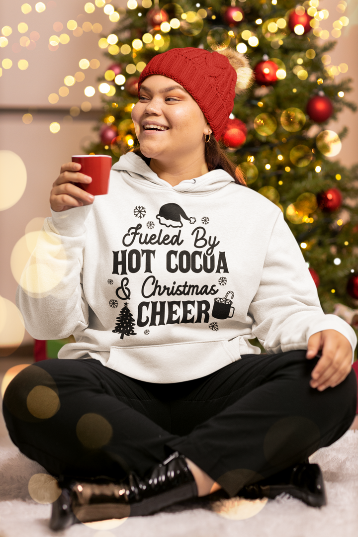 "Fueled by Hot Cocoa & Christmas Cheer" Unisex Hoodie by RanggRiwaaz for Christmas Eve, Christmas celebration